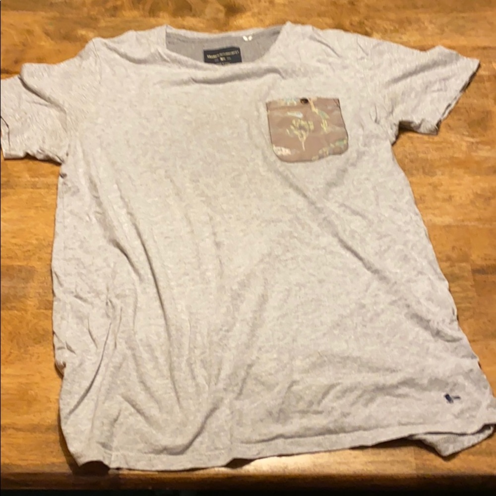 Modern amusement dinosaur pocket tee grey